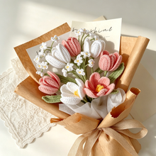Handmade crochet flower bouquet with pink and white tulips, small white flowers and green leaves