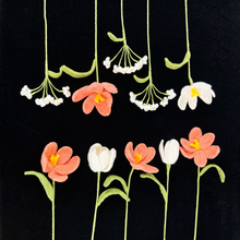 Handmade crochet flowers with pink and white tulips and small white blossoms